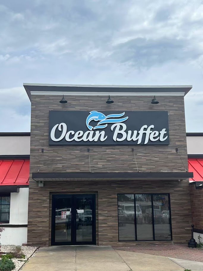 Buffet tables with seafood dishes and sushi.